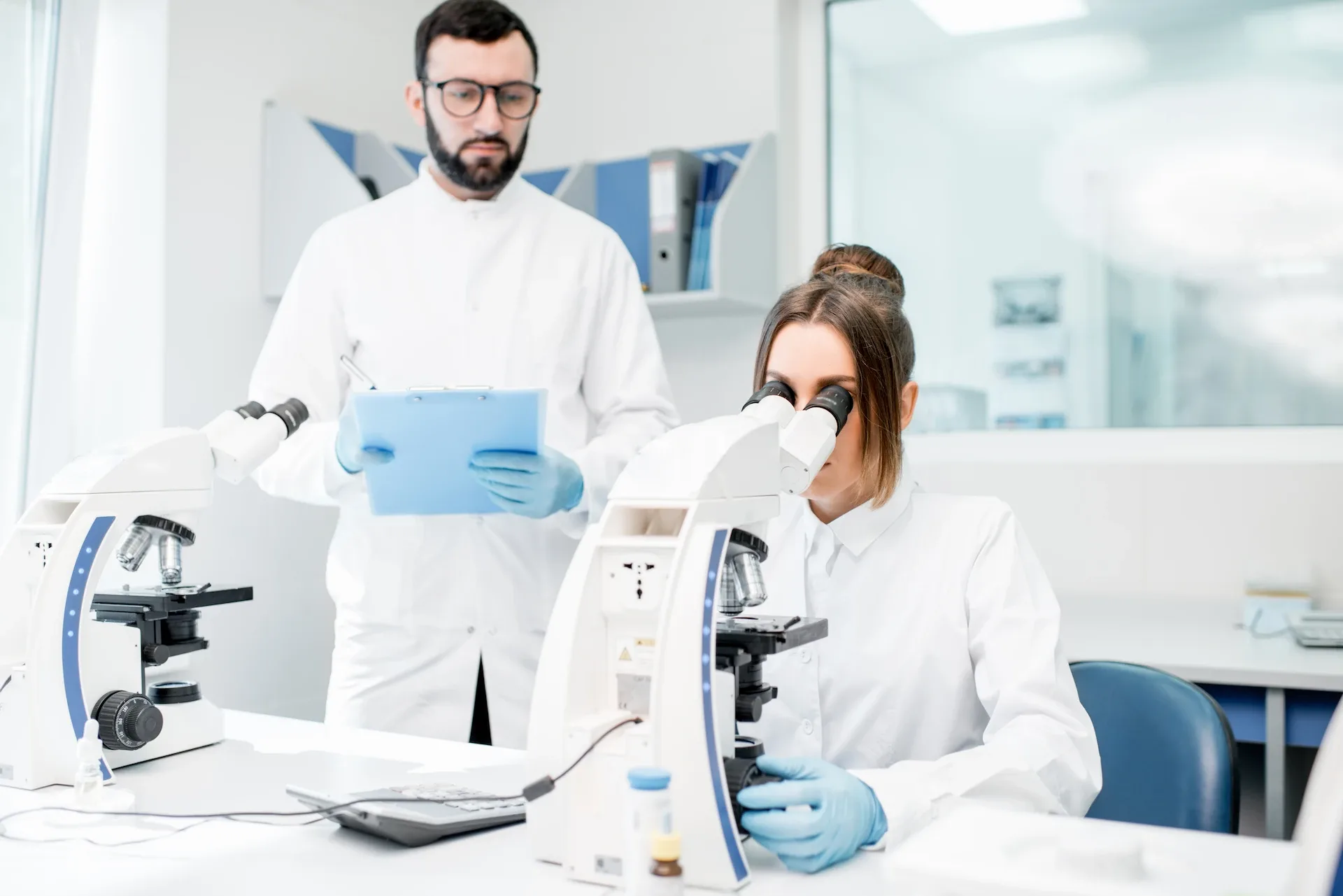 Medics working with microscope at the laboratory 2023 11 27 05 34 25 utc